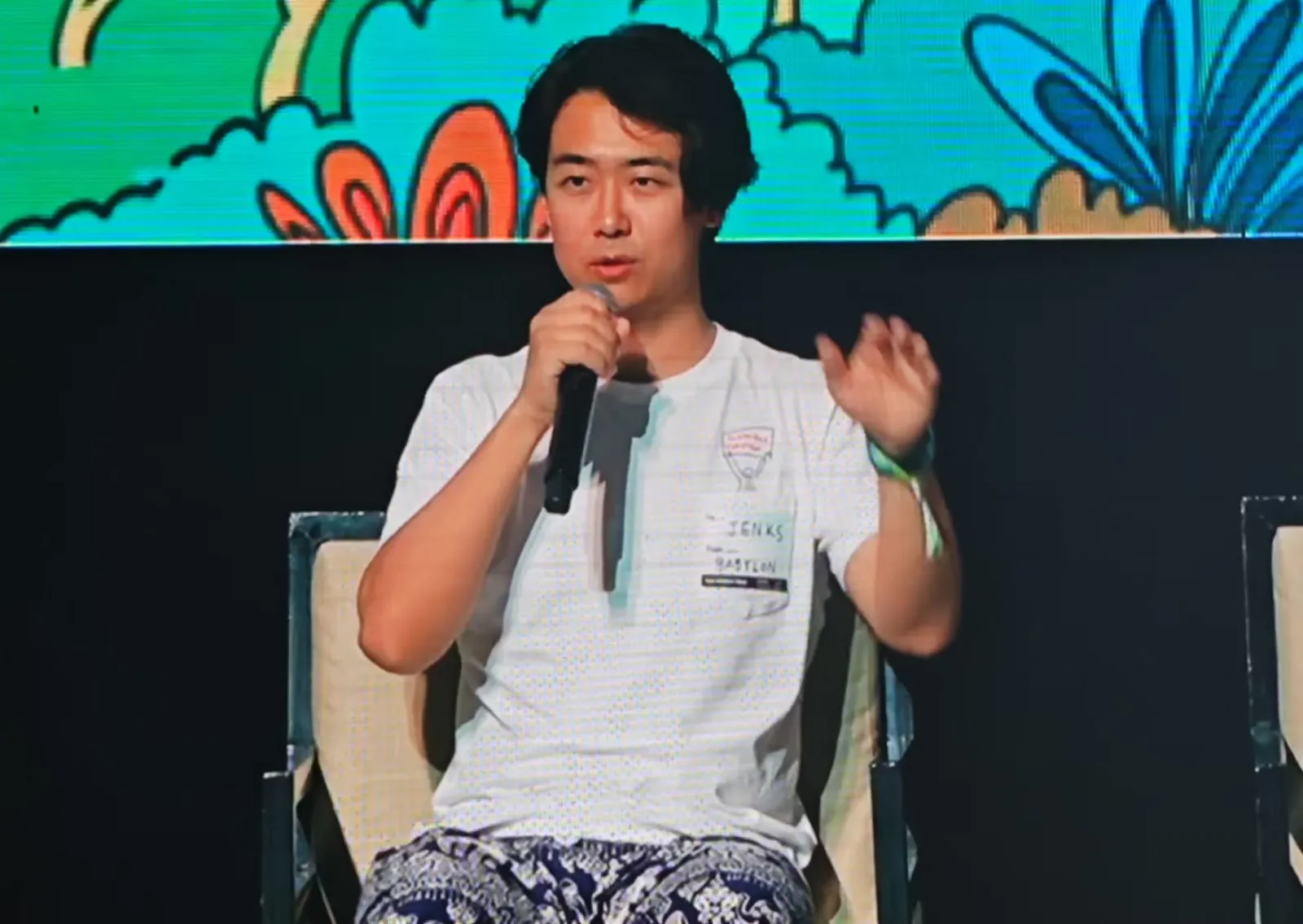 Jenks speaking on a panel